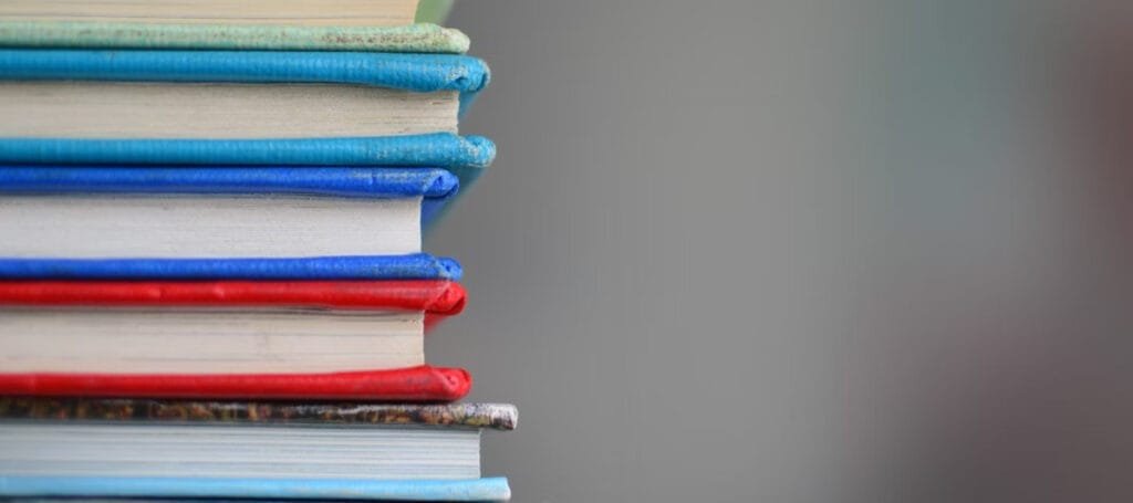 a stack of books with different colored covers