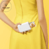 a woman holding a device with a cat inside